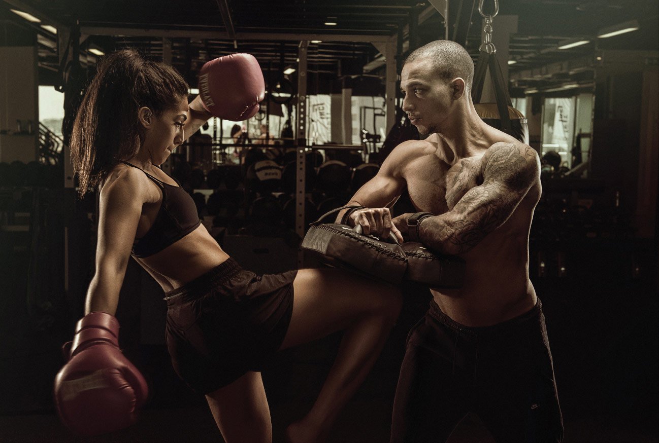 Artistic Muay Thai photoshoot of two people training at the gym